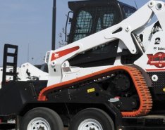 Bobcat Loader on a trailer to represent GVWR