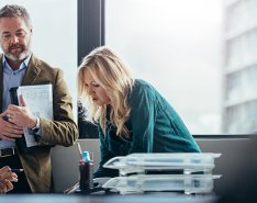 3 people meeting in an office