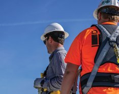 Workers wearing safety equipment