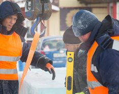 Construction workers in snow