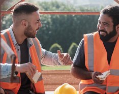 Two workers talking and smiling