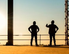 Workers looking at horizon