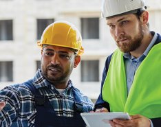 Two workers/Adobe Stock